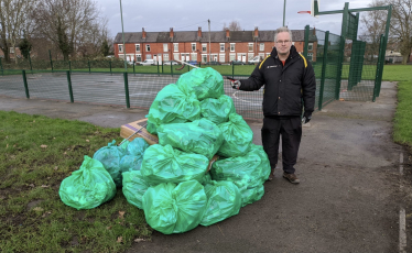 Roger and Filled Green Bags